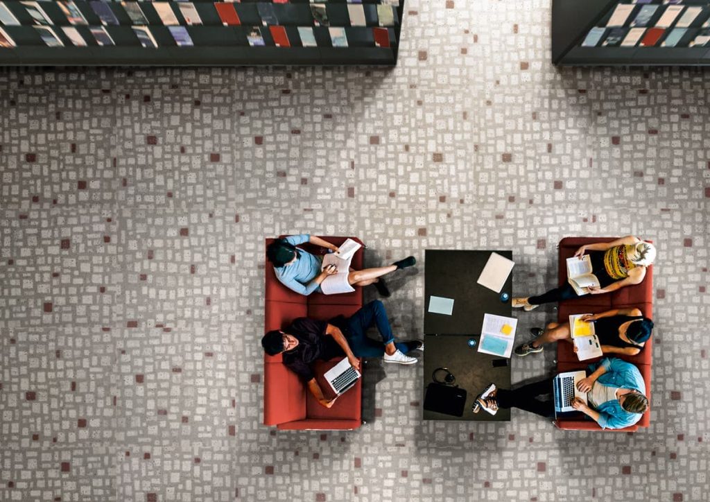 University students sitting in a library